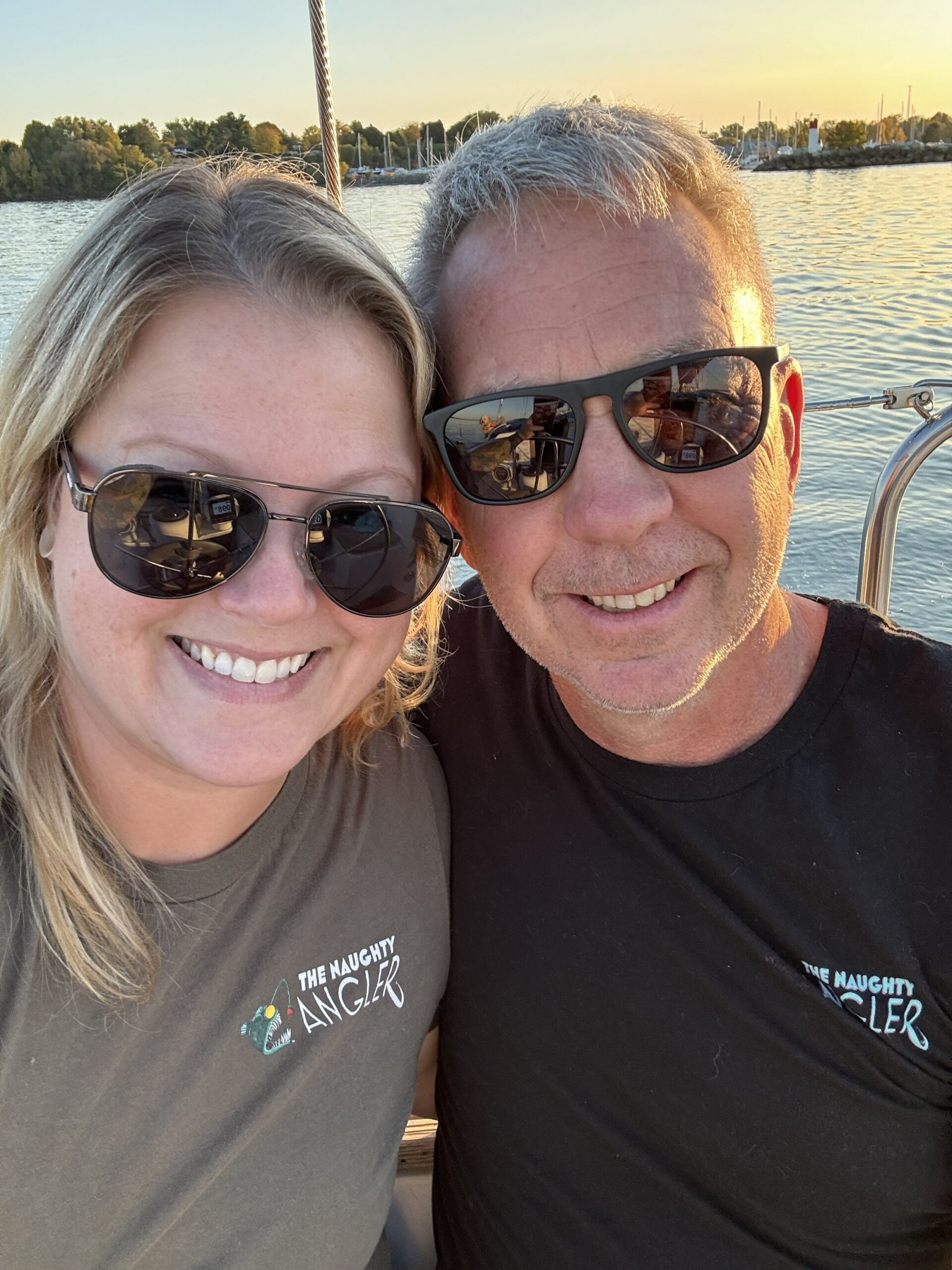 graham and natosha smiling wearing the naughty angler gear photo