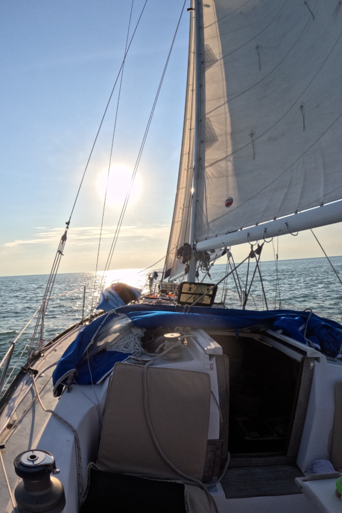 SV Naughty Angler sailboat underway on Lake Ontario heading toward the 1000 Islands during the start of the journey